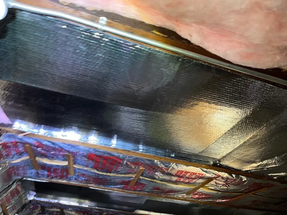 Radiant barrier foil fitted under the roof deck
